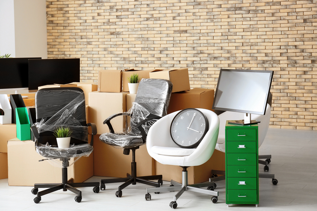Carton Boxes and Office Furniture in Empty Room